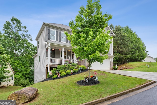 view of front of property featuring concrete driveway, covered porch, a garage, and a front yard