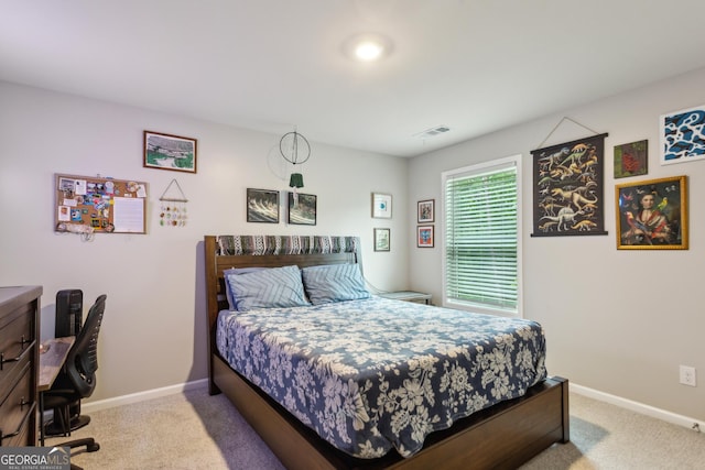 carpeted bedroom featuring baseboards