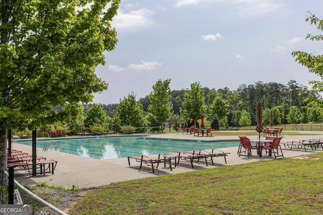 community pool with a patio