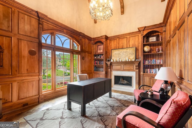 2855 Drayton Hall Dr, Buford, GA 30519 - office with an inviting chandelier, a fireplace, built in features, a towering ceiling, and wooden walls