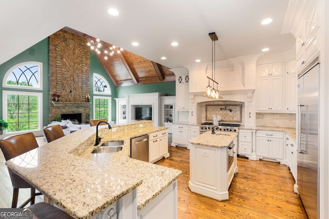 2855 Drayton Hall Dr, Buford, GA 30519 - kitchen featuring light wood finished floors, a sink, open floor plan, a large island, and stainless steel appliances