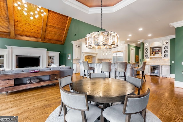 2855 Drayton Hall Dr, Buford, GA 30519 - dining room with an inviting chandelier, wine cooler, light wood-type flooring, and bar area
