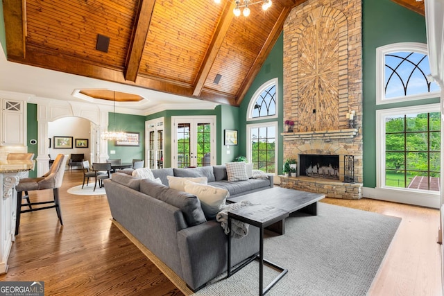 2855 Drayton Hall Dr, Buford, GA 30519 - living room with wooden ceiling, high vaulted ceiling, wood finished floors, arched walkways, and a fireplace