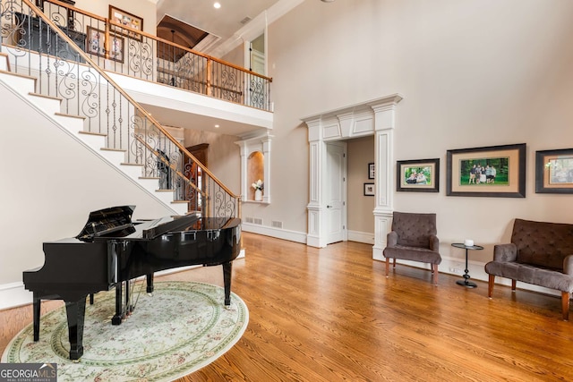 2855 Drayton Hall Dr, Buford, GA 30519 - foyer featuring stairs, a high ceiling, baseboards, and wood finished floors