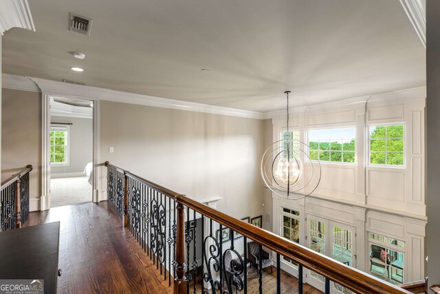 2855 Drayton Hall Dr, Buford, GA 30519 - corridor with ornamental molding, an upstairs landing, a chandelier, and wood finished floors
