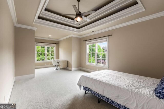 2855 Drayton Hall Dr, Buford, GA 30519 - bedroom featuring crown molding, carpet flooring, a ceiling fan, a tray ceiling, and baseboards