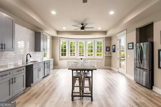 2855 Drayton Hall Dr, Buford, GA 30519 - kitchen featuring a sink, ceiling fan, appliances with stainless steel finishes, light stone counters, and recessed lighting