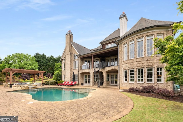 2855 Drayton Hall Dr, Buford, GA 30519 - back of house with a patio, a chimney, french doors, and a balcony