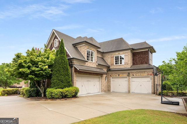 2855 Drayton Hall Dr, Buford, GA 30519 - view of front of home featuring concrete driveway, brick siding, roof with shingles, and a garage