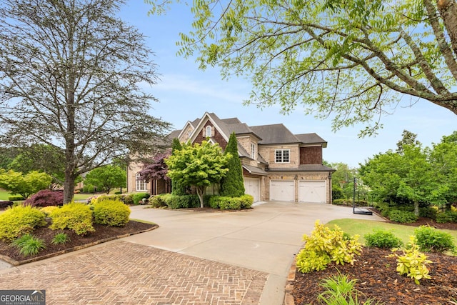 2855 Drayton Hall Dr, Buford, GA 30519 - craftsman-style home with roof with shingles, driveway, and a garage