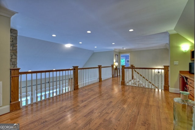 bonus room with recessed lighting, baseboards, lofted ceiling, and wood finished floors