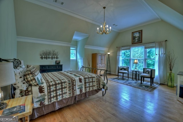 bedroom featuring visible vents, ornamental molding, an inviting chandelier, wood finished floors, and vaulted ceiling