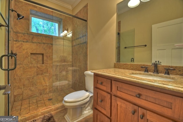 bathroom featuring crown molding, vanity, a stall shower, and toilet