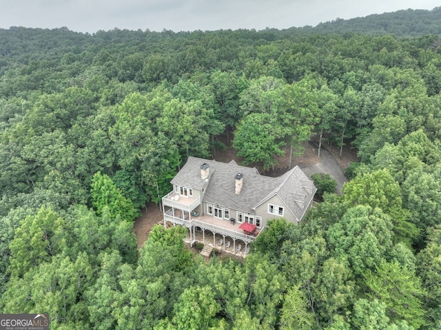 aerial view featuring a view of trees