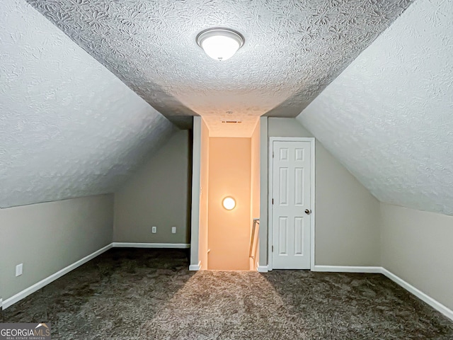 bonus room with baseboards, a textured ceiling, and lofted ceiling