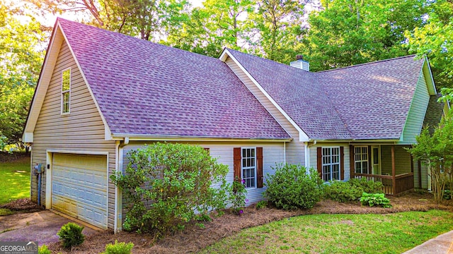 view of front of property with a porch, a shingled roof, and a chimney