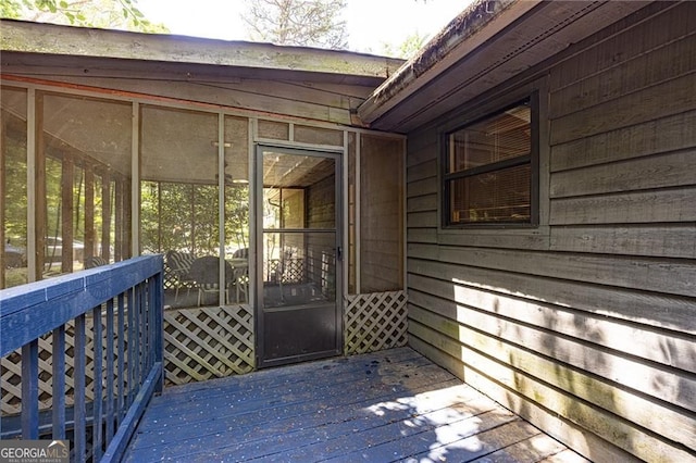 633 Iris Rd, Pine Lake, GA 30072 - wooden deck with a sunroom