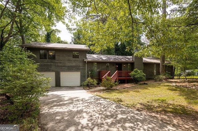 split level home with a garage and driveway