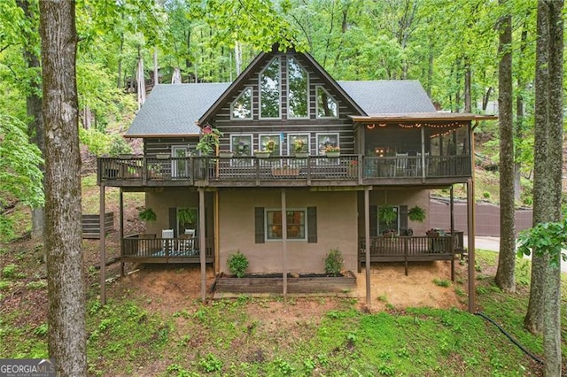 334 Little Pine Mountain Rd, Jasper, GA 30143 - back of house featuring a deck, a view of trees, a sunroom, and stucco siding