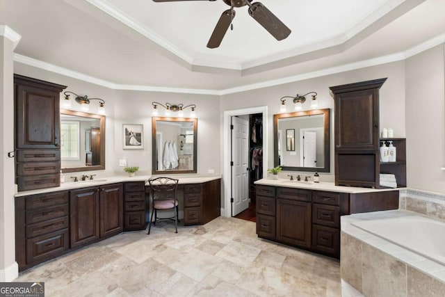 full bath featuring a sink, a raised ceiling, ceiling fan, and crown molding