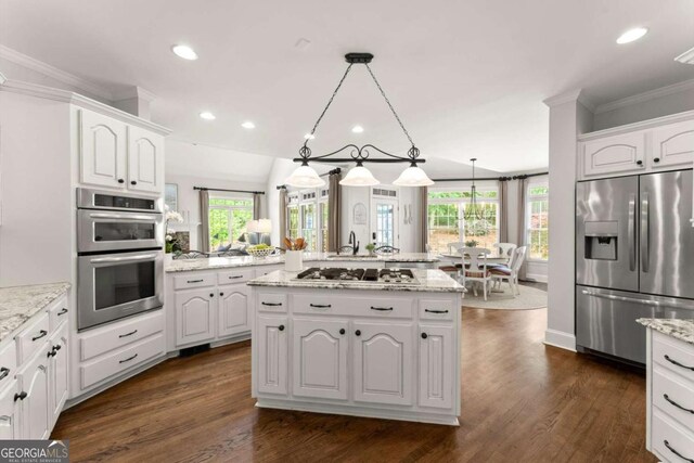 kitchen with crown molding, white cabinetry, appliances with stainless steel finishes, and dark wood-style floors