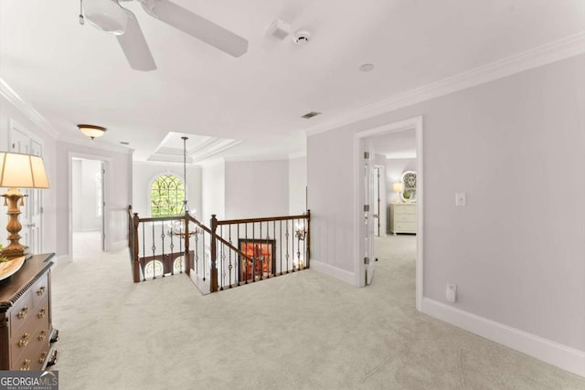 hall featuring light carpet, baseboards, an upstairs landing, visible vents, and ornamental molding