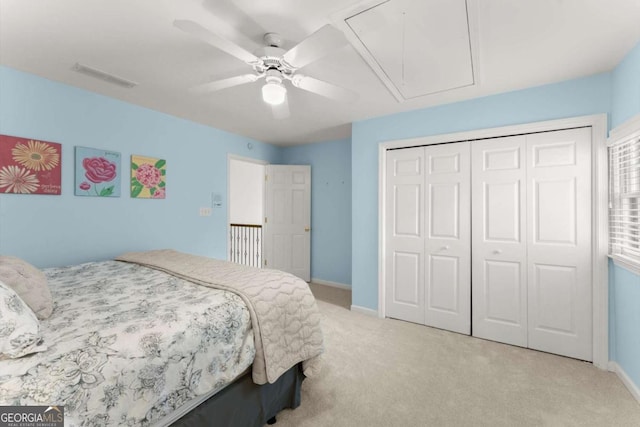 bedroom with carpet floors, attic access, baseboards, and visible vents