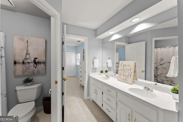 full bathroom featuring double vanity, a sink, baseboards, toilet, and recessed lighting