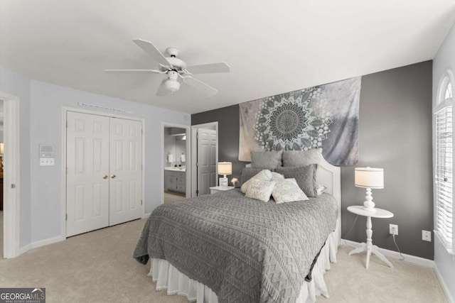 carpeted bedroom featuring baseboards, ceiling fan, and a closet