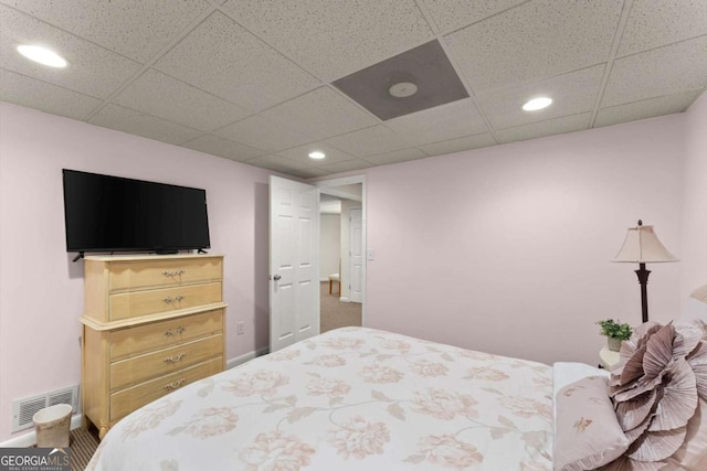 bedroom featuring recessed lighting, visible vents, and a drop ceiling