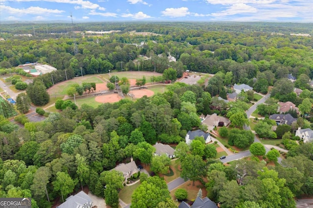 drone / aerial view featuring a forest view