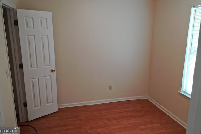 302 Kensington Cir, Warner Robins, GA 31093 - unfurnished room with baseboards and wood finished floors
