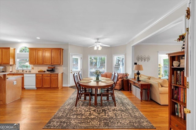 6034 Addington Dr NW, Acworth, GA 30101 - dining area featuring a healthy amount of sunlight, ceiling fan, light wood-type flooring, and crown molding