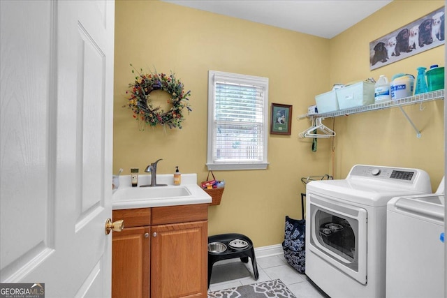 6034 Addington Dr NW, Acworth, GA 30101 - laundry room with washing machine and clothes dryer, cabinet space, a sink, light tile patterned floors, and baseboards
