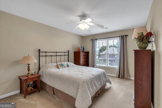 6034 Addington Dr NW, Acworth, GA 30101 - bedroom with baseboards, light carpet, a ceiling fan, and visible vents
