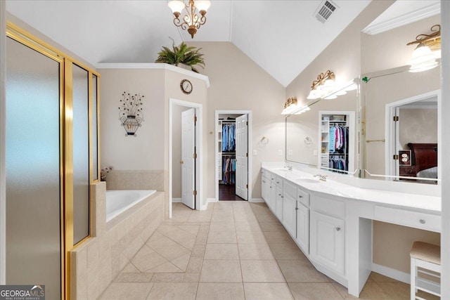 6034 Addington Dr NW, Acworth, GA 30101 - full bath featuring tile patterned flooring, a walk in closet, a bath, and visible vents