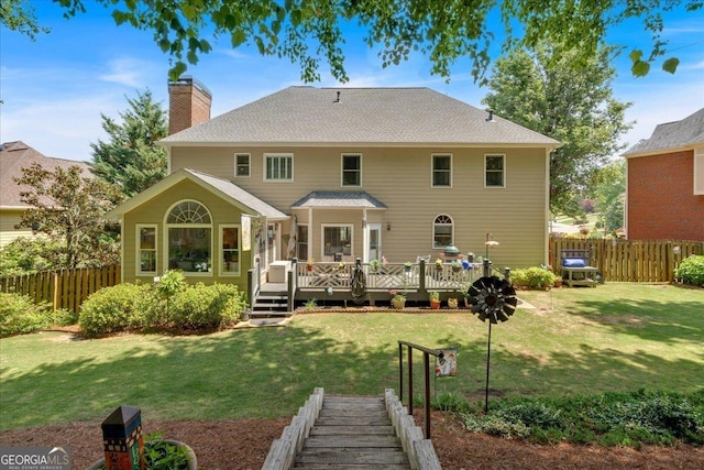 6034 Addington Dr NW, Acworth, GA 30101 - back of house with a yard, fence, a wooden deck, and a chimney