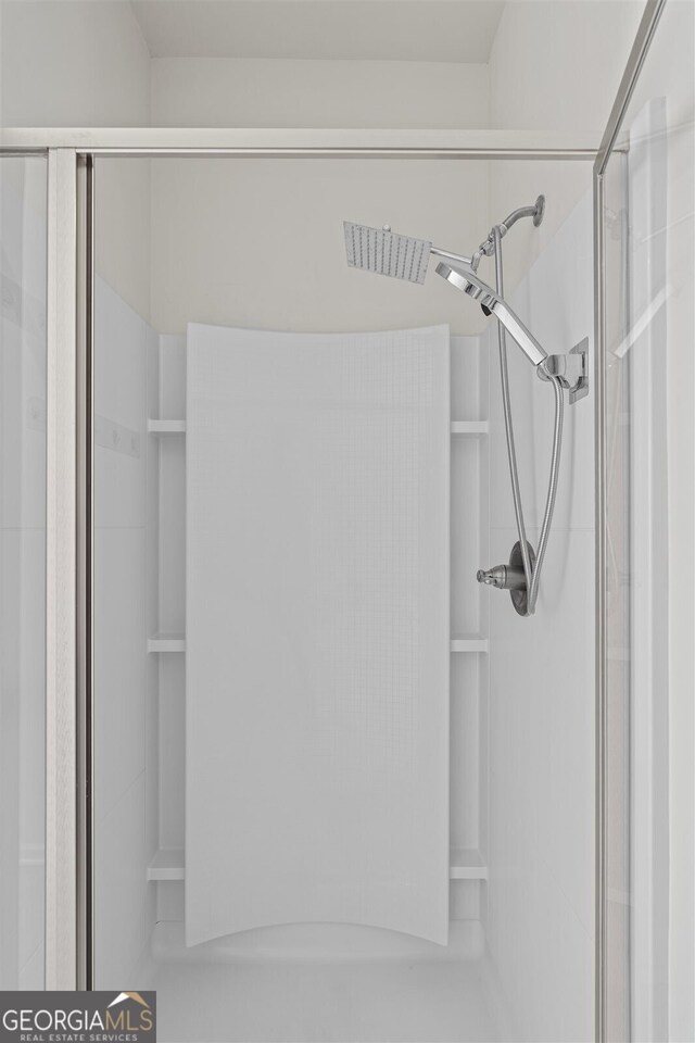 details featuring visible vents and a shower stall