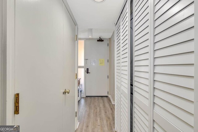 201 Neptune Rd Unit 258, Saint Simons, GA 31522 - hallway featuring baseboards and light wood finished floors
