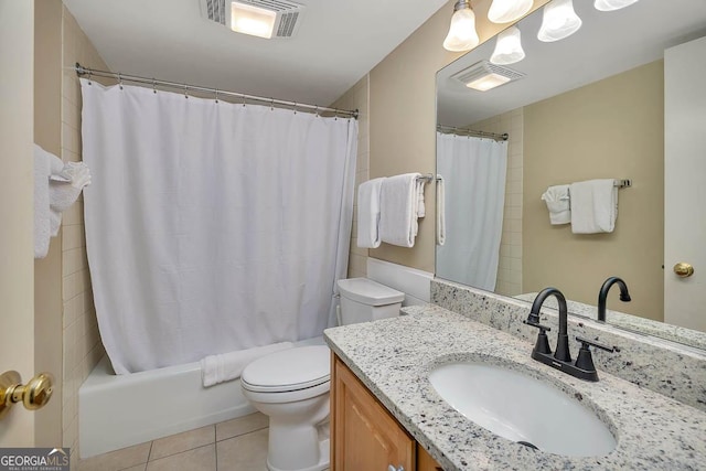 full bathroom with vanity, tile patterned flooring, toilet, and visible vents