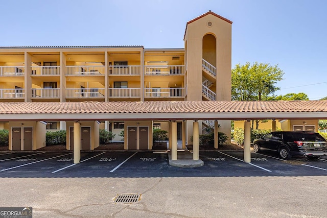 view of building exterior featuring covered parking