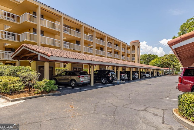 view of property featuring covered parking