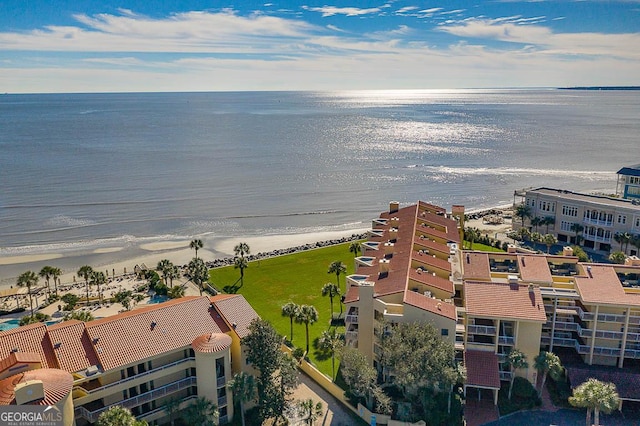 drone / aerial view with a water view and a view of the beach