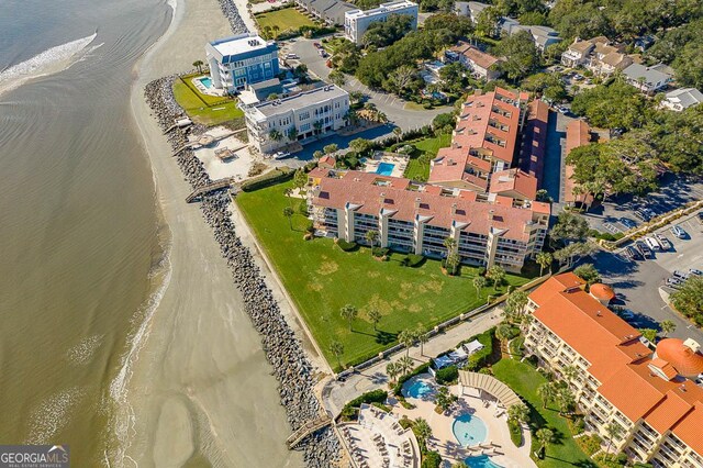 201 Neptune Rd Unit 258, Saint Simons, GA 31522 - drone / aerial view with a water view and a beach view