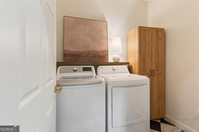 laundry area with cabinet space and washing machine and dryer
