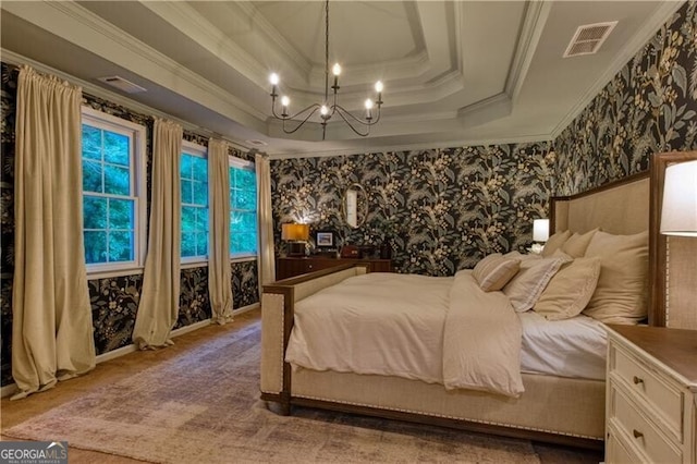 bedroom featuring a raised ceiling, ornamental molding, a chandelier, light colored carpet, and wallpapered walls