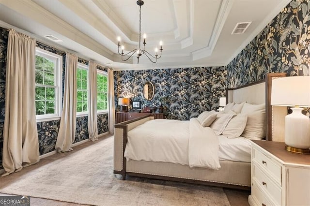 bedroom with wallpapered walls, a tray ceiling, a chandelier, and crown molding