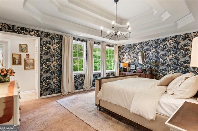 bedroom with a tray ceiling, crown molding, wallpapered walls, a chandelier, and baseboards
