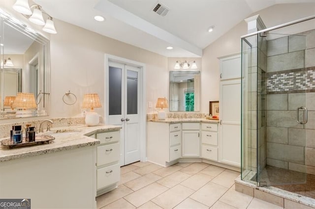 full bathroom featuring lofted ceiling, a stall shower, tile patterned floors, recessed lighting, and vanity