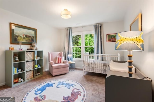 bedroom featuring carpet floors and baseboards